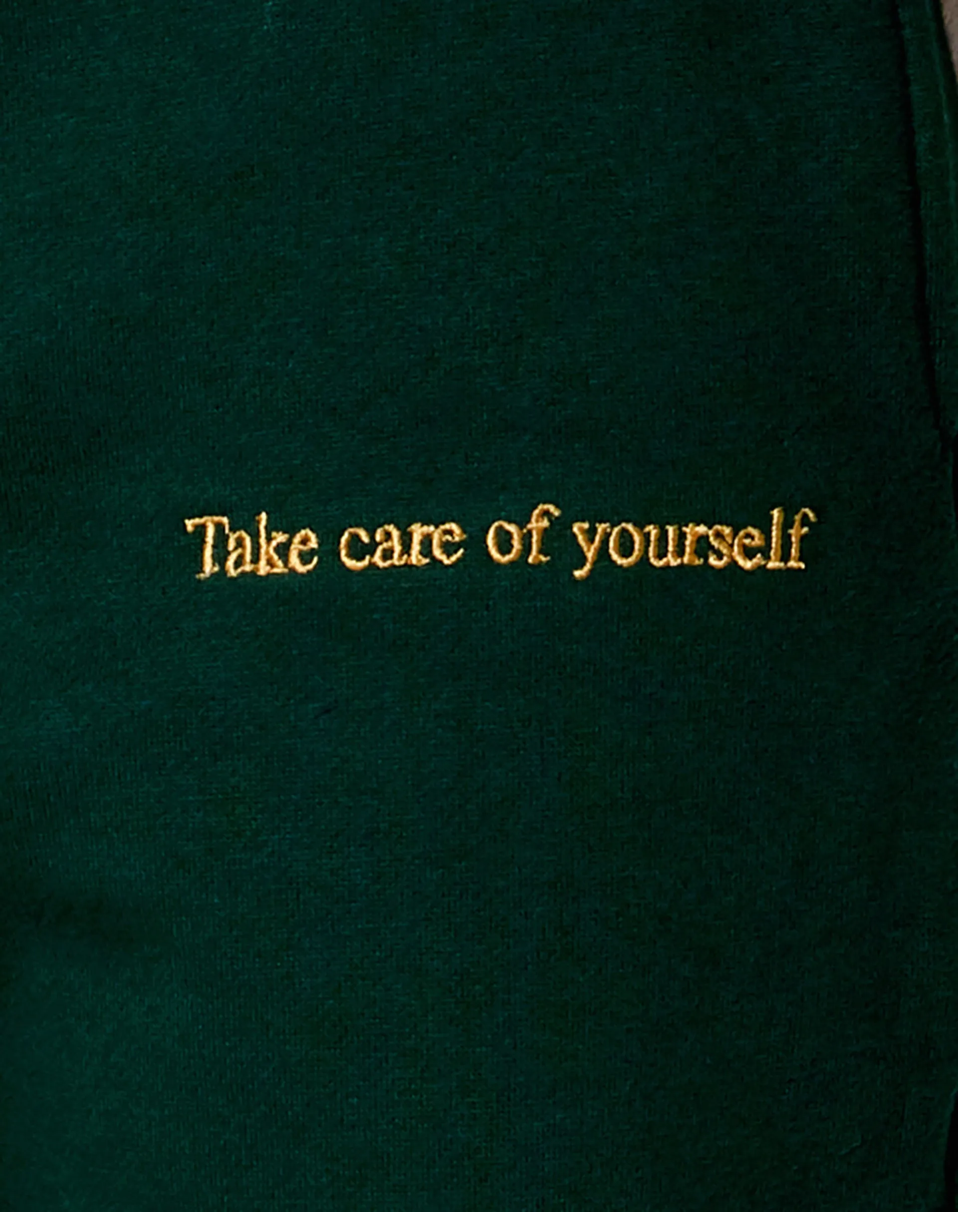 Basta Jogger in Bottle Green with 'Take Care Of Yourself' Embro